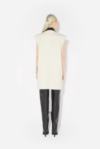 La chaqueta de traje sin mangas color vainilla