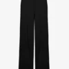 Los pantalones negros con estribos Los pantalones negros con estribos